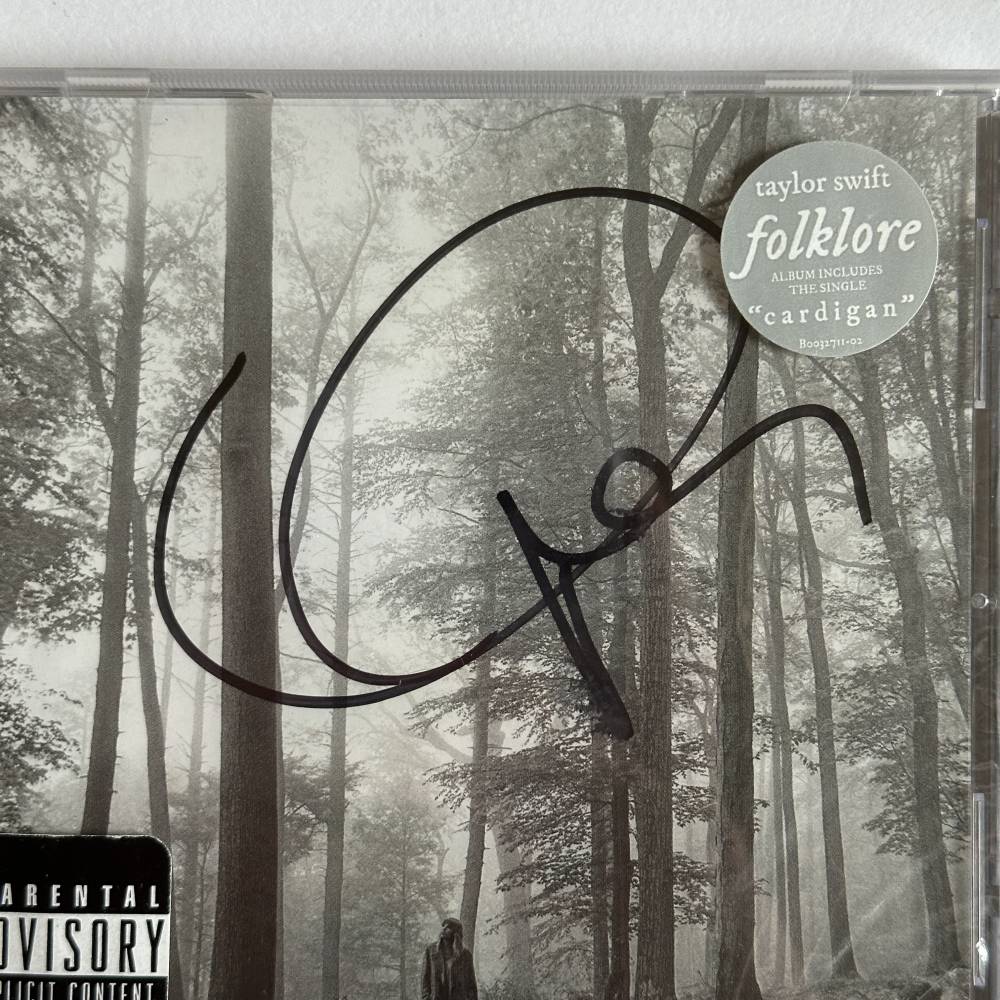 TAYLOR SWIFT SIGNED 'FOLKLORE' ALBUM