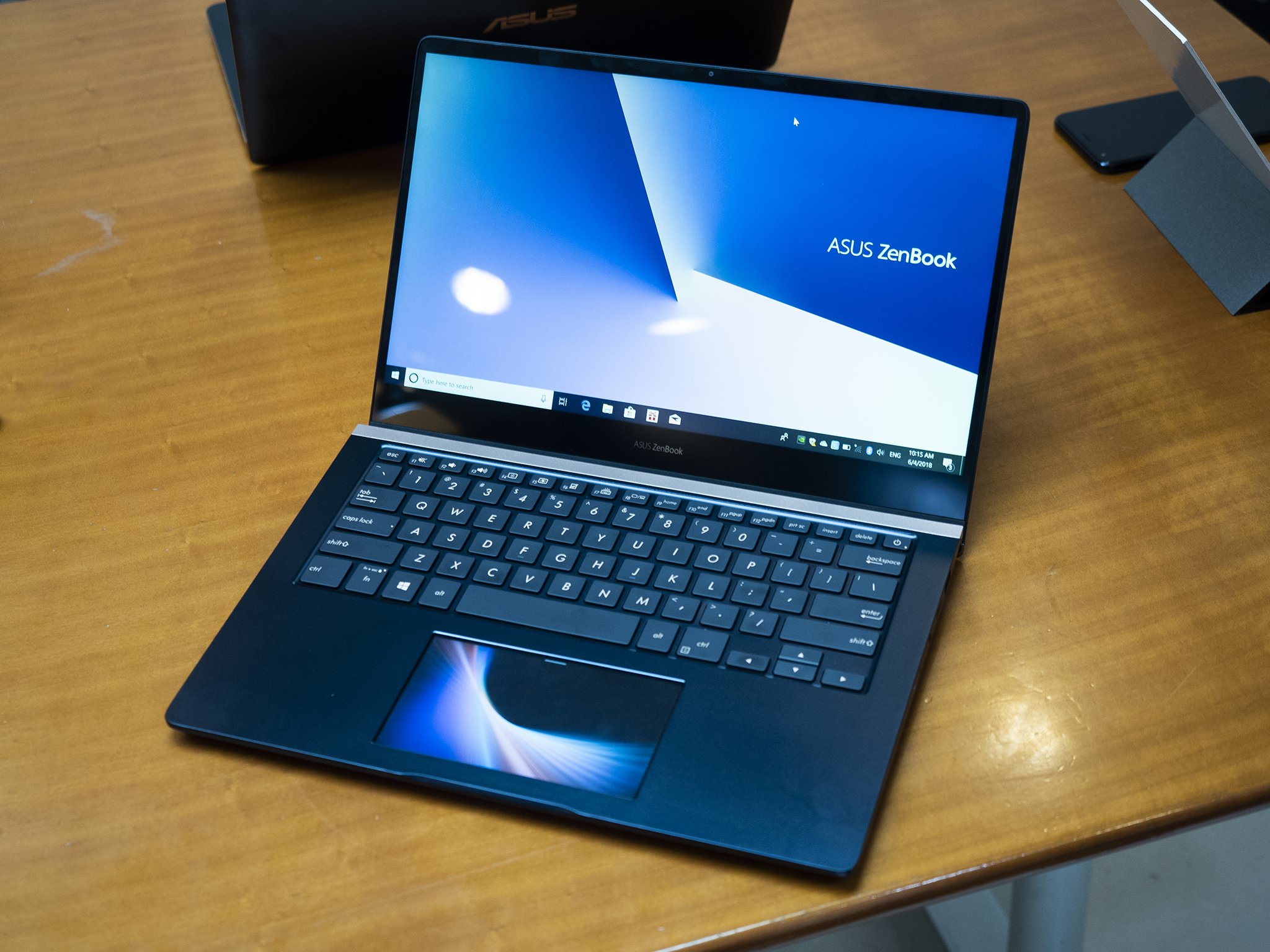 The ASUS ZenBook Pro 15 has a screen for a touchpad and I don't