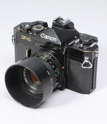 CANON F1 W 50MM F/1.8 FD LENS, HOOD, FLASH MOUNT & CAP SHUTTER