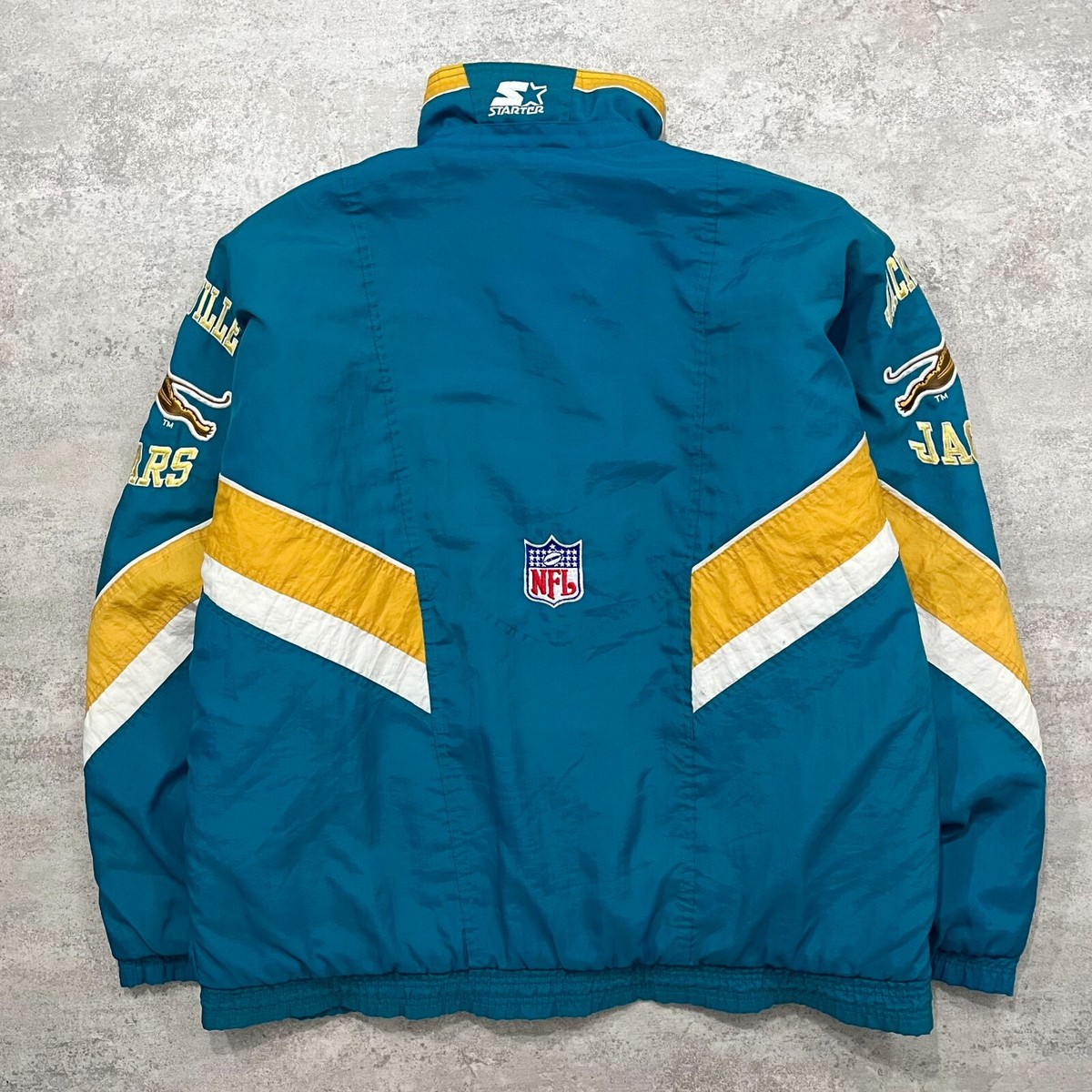 VTG 90s NFL JACKSONVILLE JAGUARS LOGO STARTER PUFFER JACKET SIZE