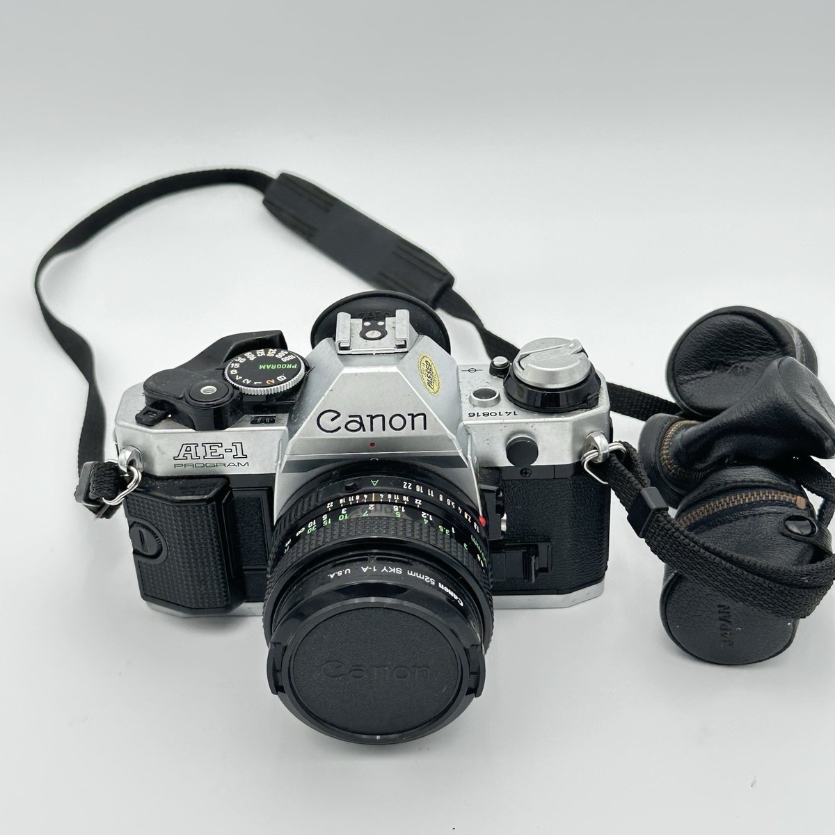 Canon AE-1 program Film Camera With 50mm Canon Lens Strap and Film
