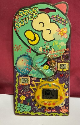 DINKIE DINO ELECTRONIC VITUAL PET ITEM # TK-910 ROKUROKU DINOKUN