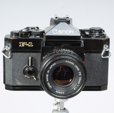 CANON F1 W 50MM F/1.8 FD LENS, HOOD, FLASH MOUNT & CAP SHUTTER