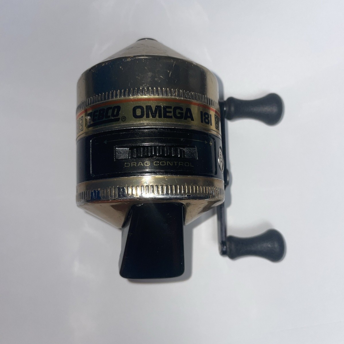 Vintage Fishing Reel ZEBCO OMEGA 181 Gold Diamond Covers Black