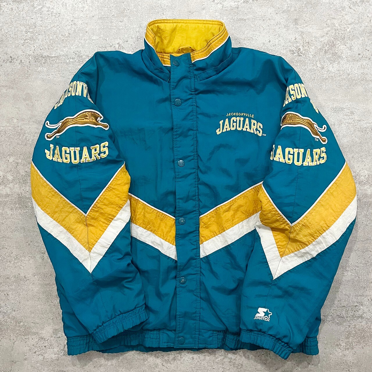 VTG 90s NFL JACKSONVILLE JAGUARS LOGO STARTER PUFFER JACKET SIZE