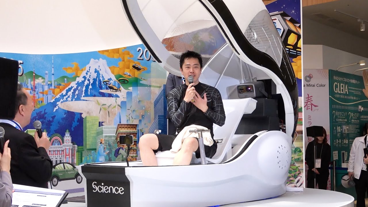 進化版「人間洗濯機」お披露目 万博大阪館、知事が体験 府・市 - YouTube