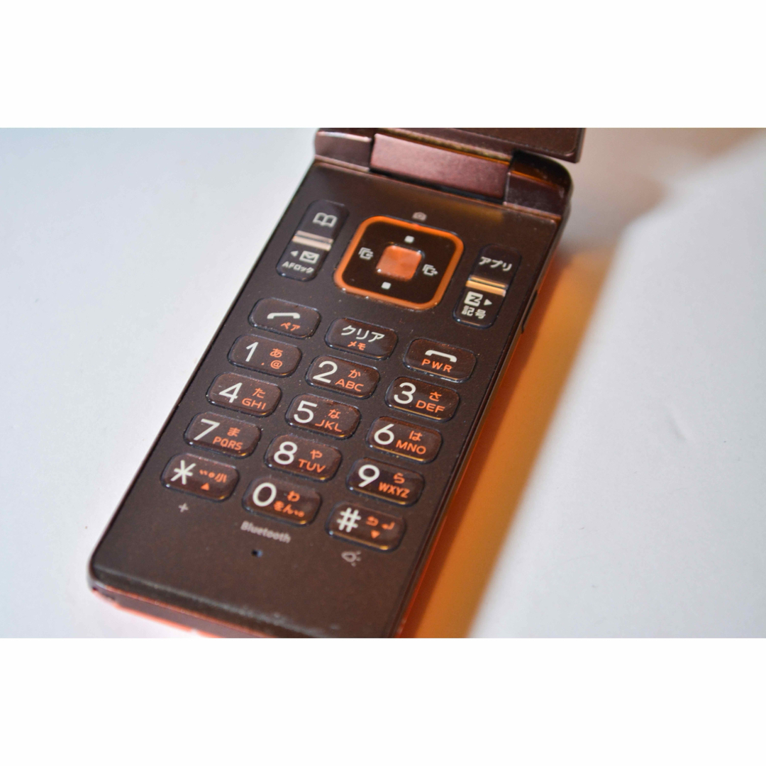 GRATINA KYY06 折りたたみ式携帯電話 オレンジ 京セラ GRATINA KYY06