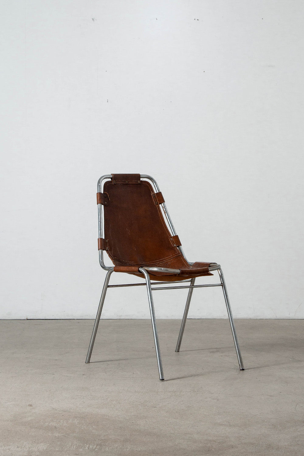 stoop | Les arcs Chair in Leather and Steel by Charlotte Perriand