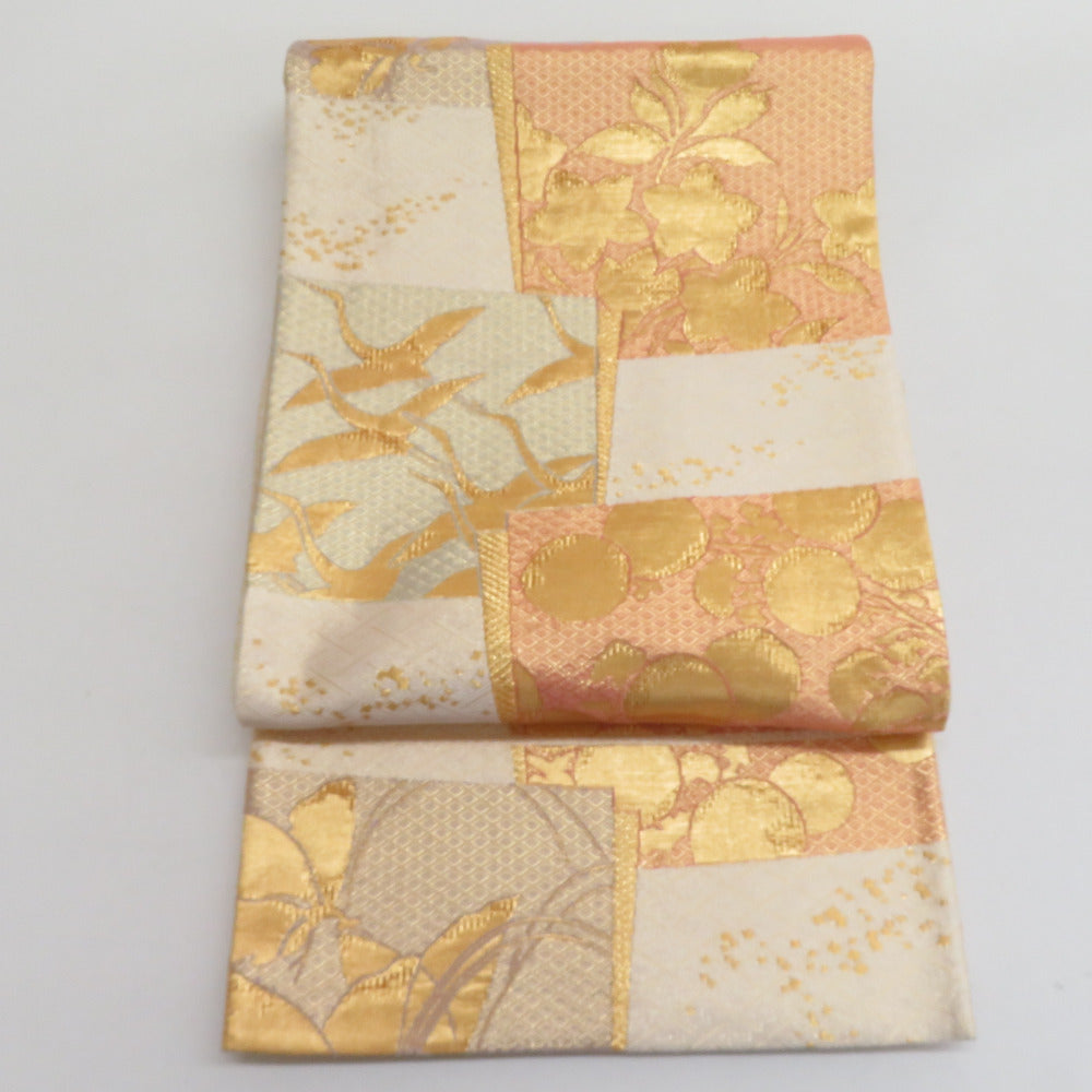 袋帯 岡野武武一郎 本綾佐賀野錦 紗綾形に花や鶴など 金x白xオレンジ