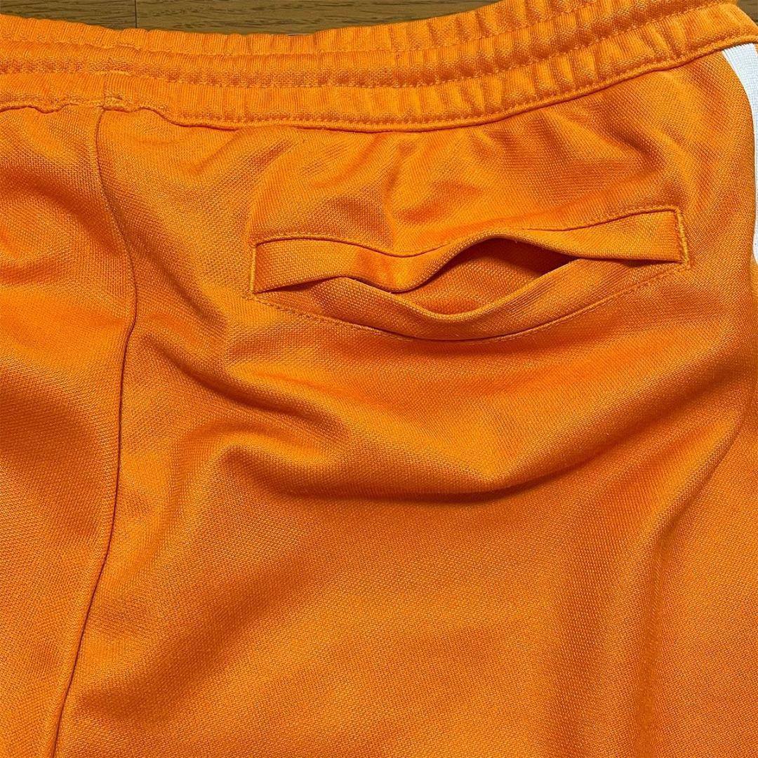 ベッケンバウアー 古着 adidas アディダス トラックパンツ オレンジ M
