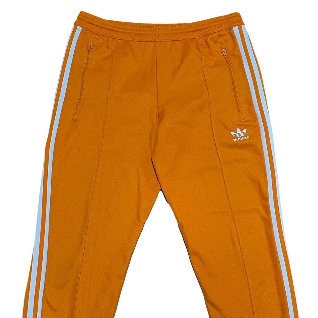 ベッケンバウアー 古着 adidas アディダス トラックパンツ オレンジ M