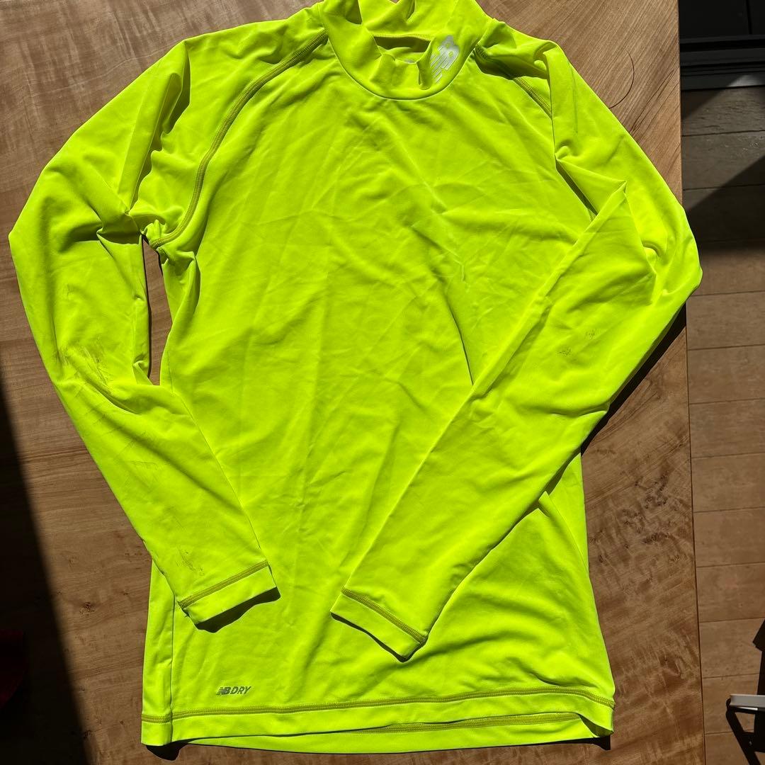 New Balance 蛍光イエロー 長袖シャツ - メルカリ