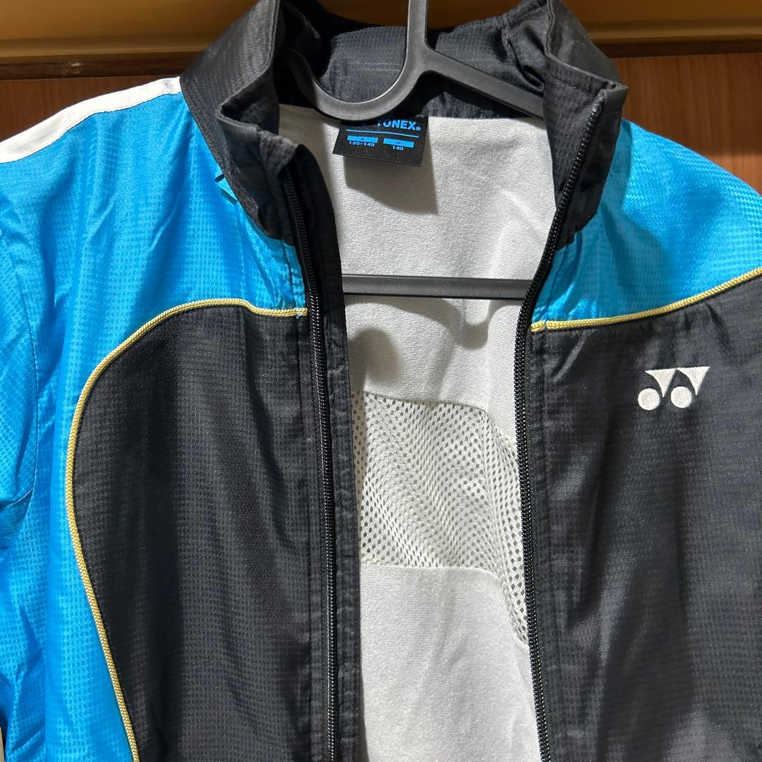 ヨネックス ウインドブレーカー 黒/青 J140 - メルカリ