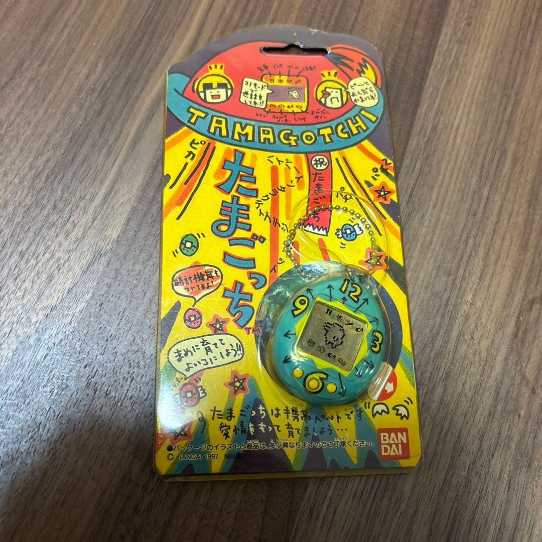 新品】 BANDAI 初代たまごっち ブルー 水色 時計柄 香港版 - メルカリ